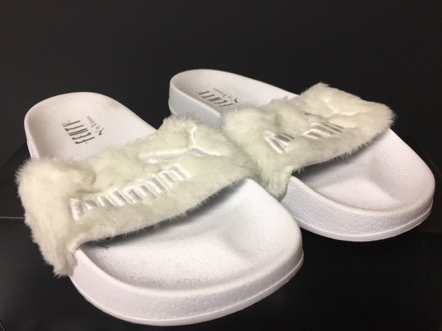 white fluffy puma slides