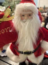 Santa, 2017 super plush, stands alone. He is 9" tall. The face is great 