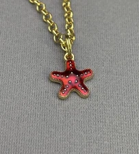 Red Starfish pendant necklace Gold Toned Chain