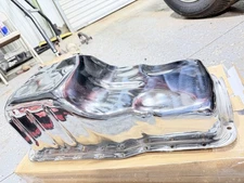 Trans-Dapt Performance chrome oil pan for a Ford small block engine.