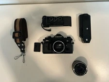 Canon A-1 35mm w/ 50mm 1.8, Data Back A and Power Winder A2 (manuals included)