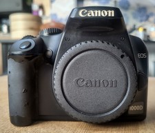 Canon EOS 1000D 10.1 MP Digital SLR Camera, Black, Body + battery + charger.