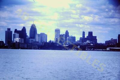 Vintage Slide Photo City Skyline Over Calm Waters With Vivid Clouds