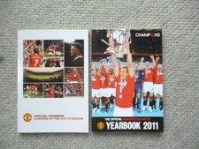 Manchester United FC handbooks x 2 . 2011 and 2014/15