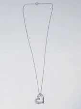 Zales 1/4 CT. T.W. Diamond Looped Tilted Heart Pendant in Sterling Silver