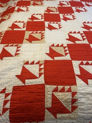 Handmade cotton quilt in 'Feathered Star' pattern - red and white color scheme