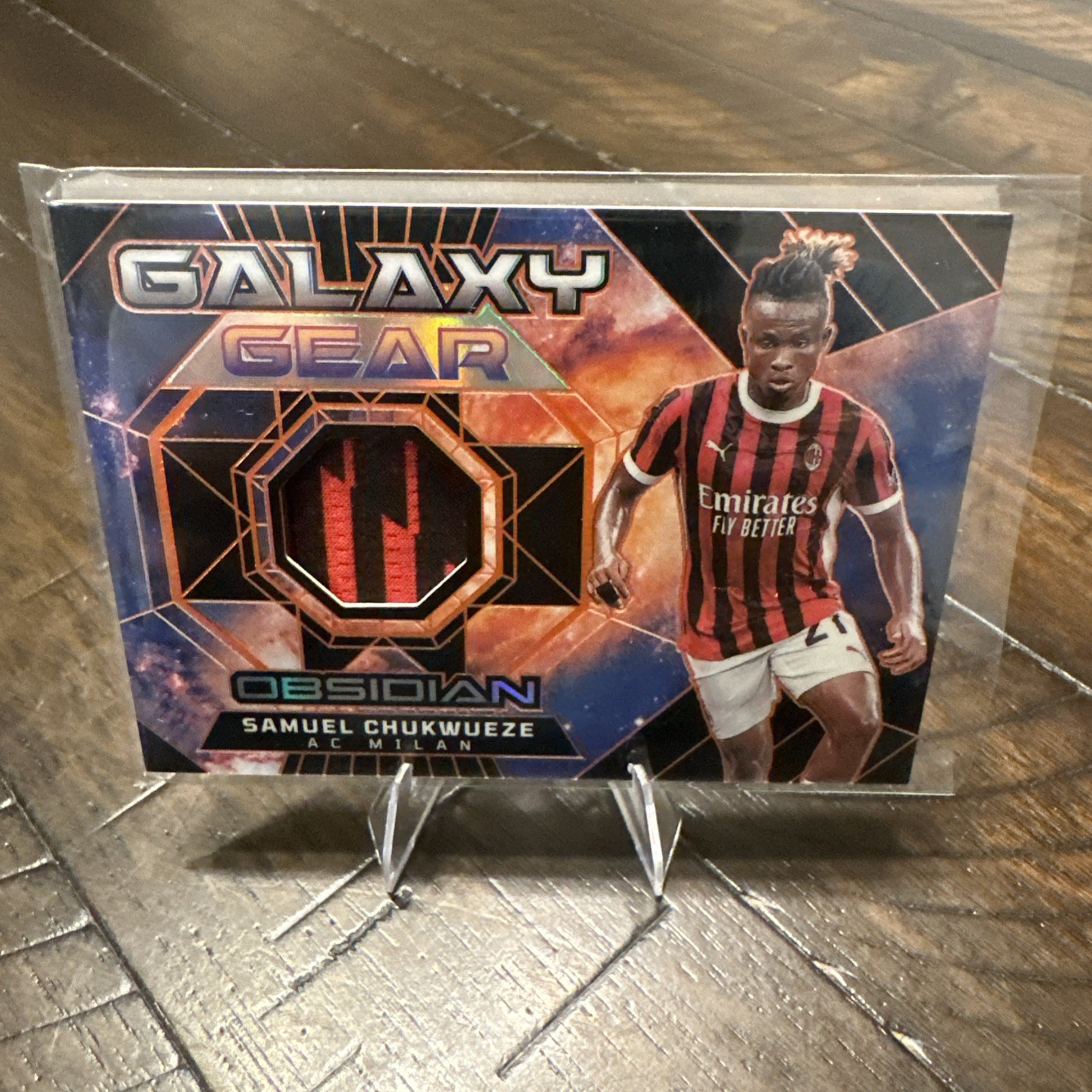 Samuel Chukwueze 2024-25 Panini Obsidian Galaxy Gear Patch Orange 63/99 #GG-SC