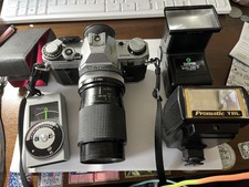 Canon AE-1 SLR Film Camera - Black 2ea flashes 1ea light meter wzoom lens