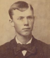 PORTRAIT OF HANDSOME YOUNG MAN W/ RIBBON TIE