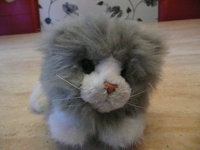 Toy cat meows and kneads