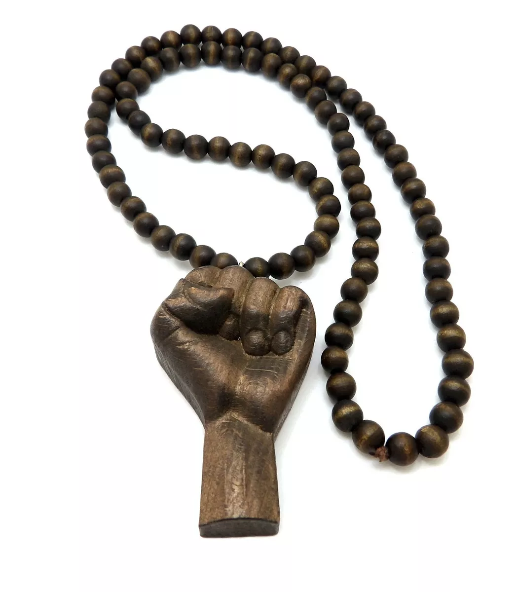 Gold black deals power fist pendant
