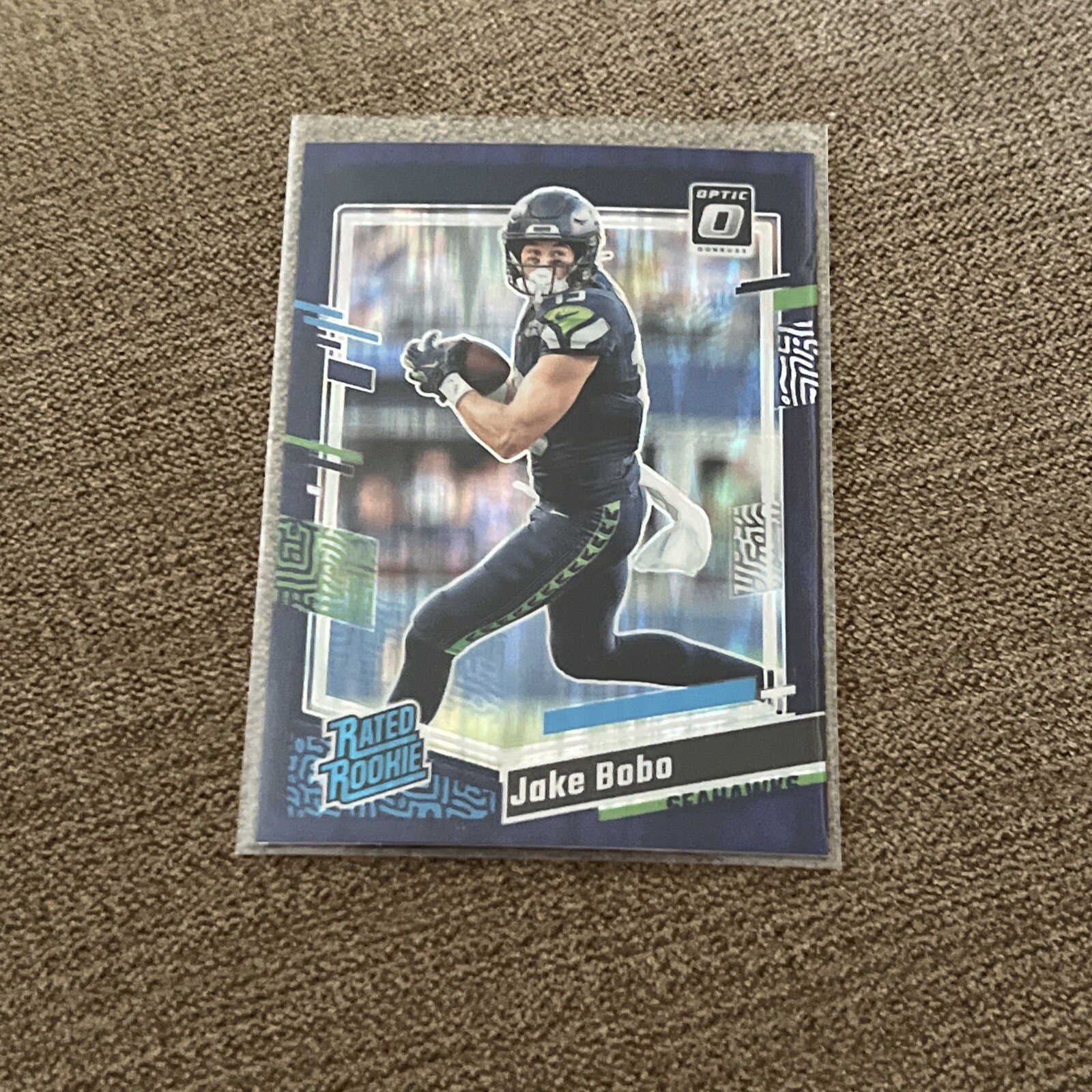2023 Donruss Optic #288 Jake Bobo Purple Shock Prizm RC Holo Seattle Seahawks