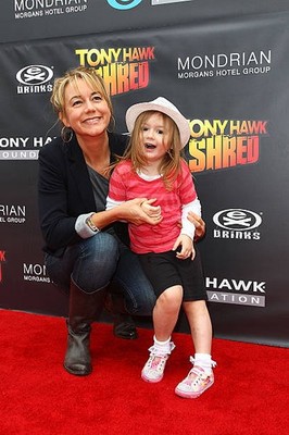 Megyn Price and daughter arrives at the Tony Hawk Shred Presents S- Old Photo 1