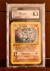 CGC 8.5 Machamp 8/102 Holo 1st Edition Base Set Unlimited Pokémon Card