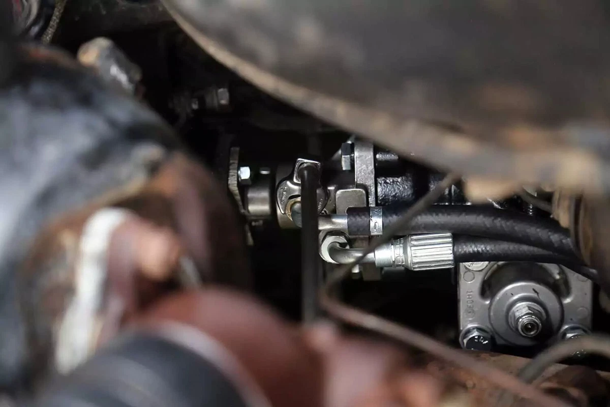 New power steering lines connected to the replacement gearbox.
