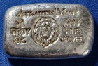 A Atlantis Mint LION- 1 oz .999 Fine Silver Hand Poured Bar