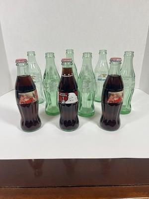 Vintage (9) Coke A Cola Bottles Christmas Santa