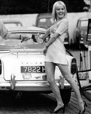 Yutte Stensgaard clowns with gas pump fueling her Triumph TR6 24x30 inch poster