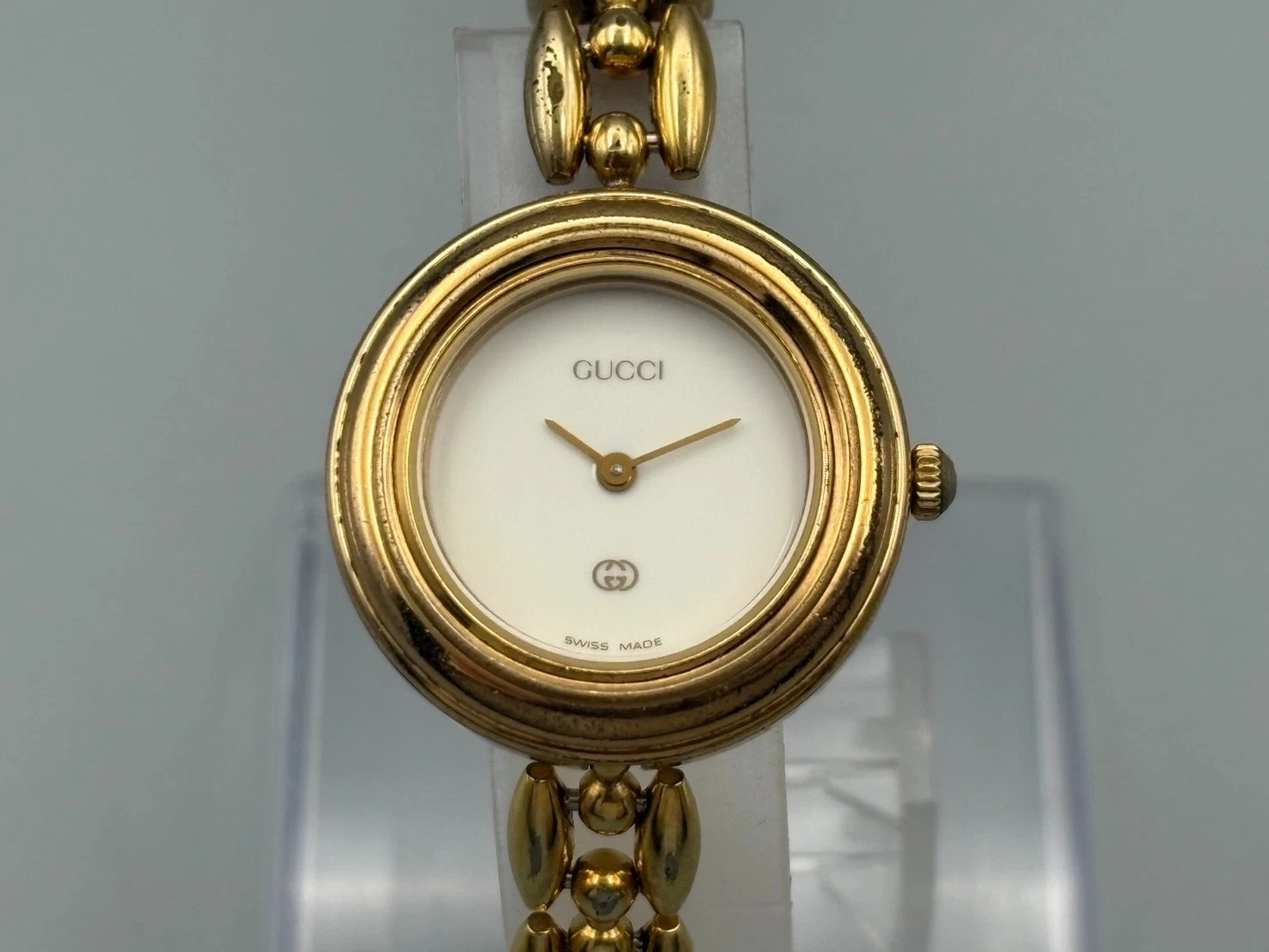 Montre femme vintage Gucci lunette change 1200 cadran doré blanc
