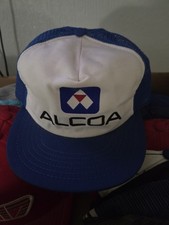 vintage Alcoa trucker hat features a white front panel with a blue logo and mesh