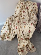 Pair of drawback floral design curtains on a cream background W85-181xD206cm