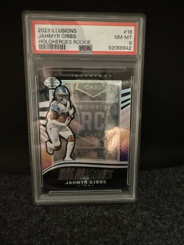 2023 Panini Illusions - Holoheroes Rookie Jahmyr Gibbs #16 (RC) & Purple Shock‼️