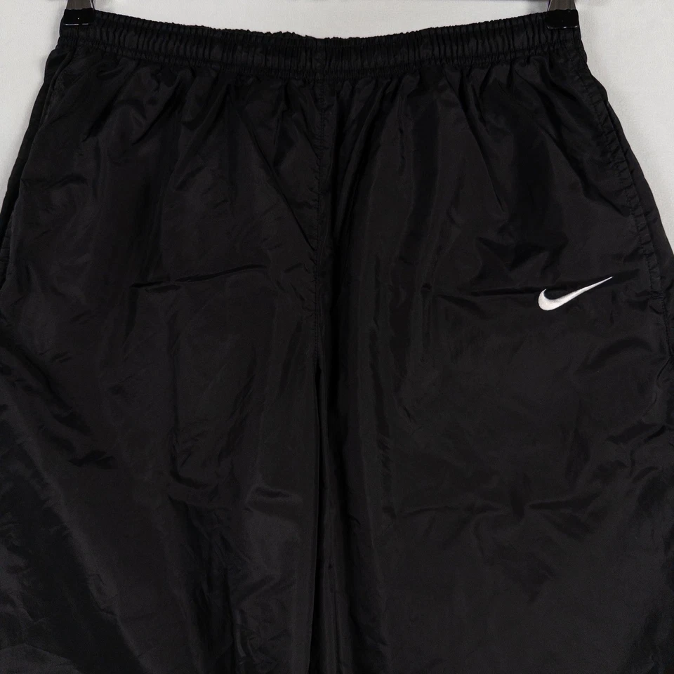 Pantalones de chándal Nike para hombre grandes negros blancos de nailon estilo vintage años 90 puños con cremallera Y2K Foto 2 de 4