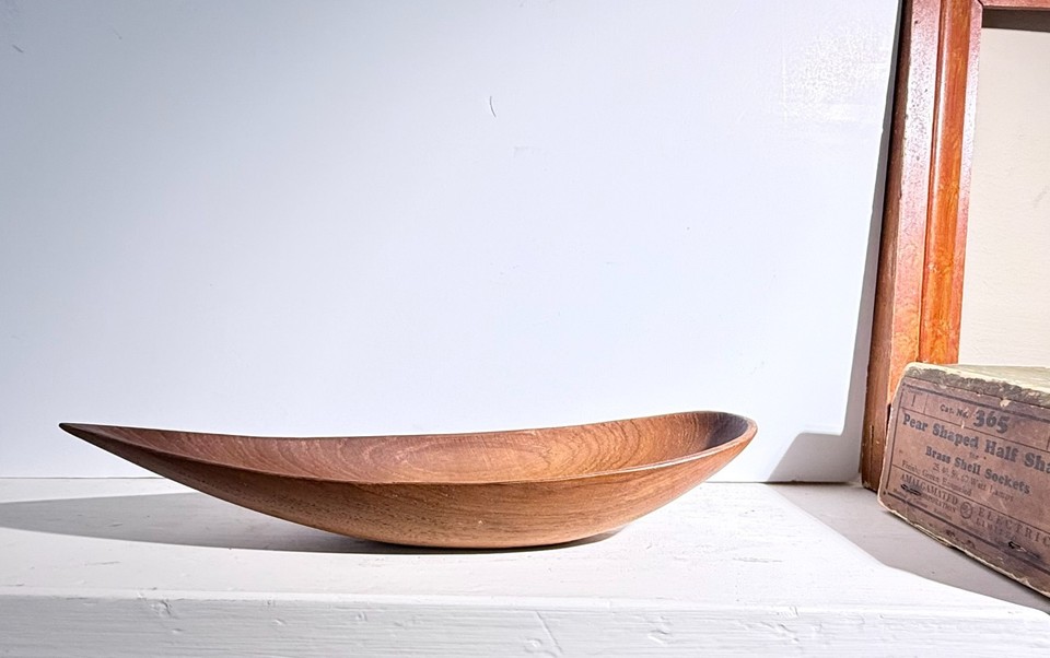 A 1960s Swedish teak 'canoe bowl' by Stig Sandqvist — the organic sculptural form makes this functional art, not just a bowl.