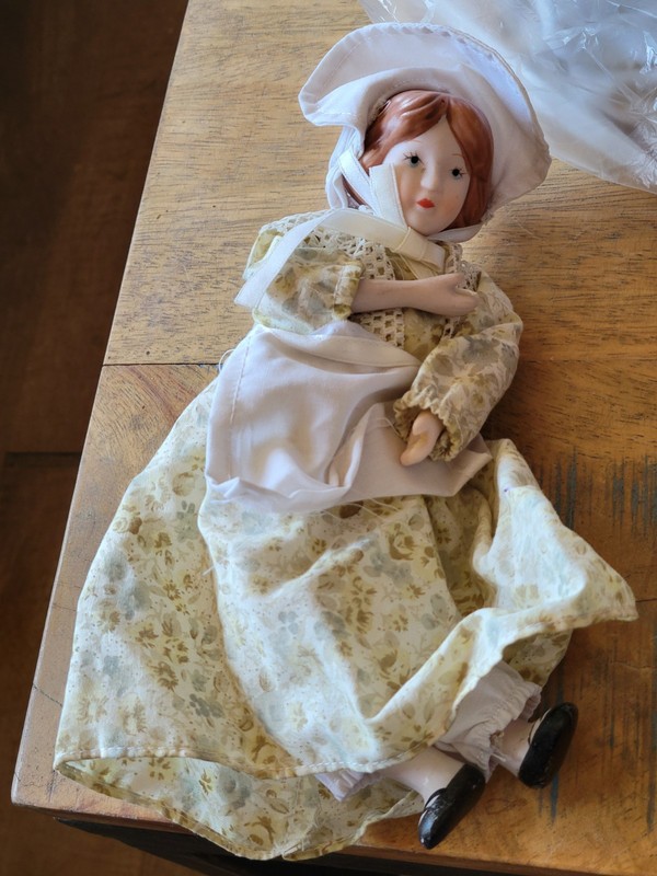 Vintage-style porcelain collectible doll