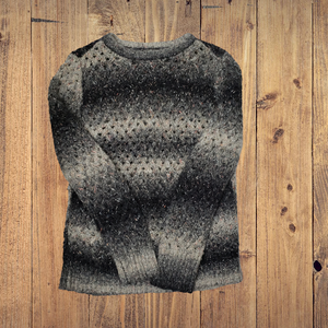 gray sweater with black stars
