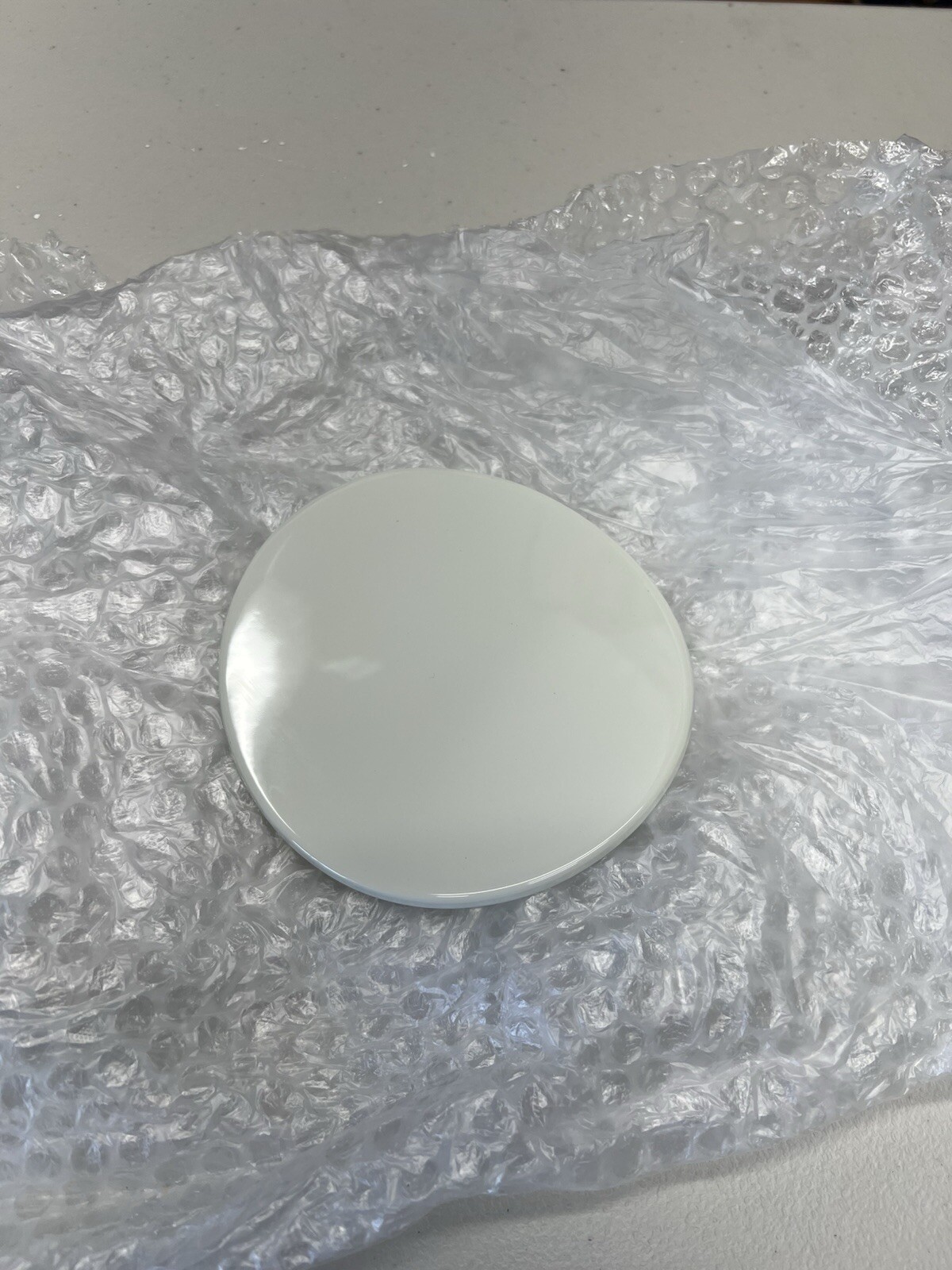 Used Ferrari F12 fuel door in factory painted non-metallic white.
