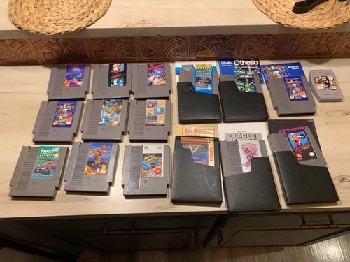 LOT OF 15 VINTAGE NINTENDO GAMES WITH MANUALS & DUST JACKETS RBI EXITEBIKE MORE