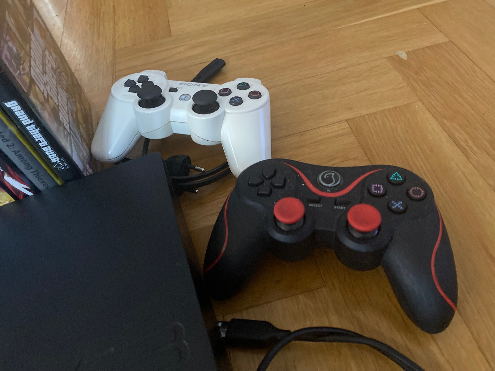 PS3 Slim Konsole schwarz, mit 13 Spielen und 2 Kontrollern! PLAYSTATION