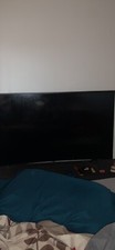 Samsung 55 inch curve 4K with a 65 inch tv stand with shelving.