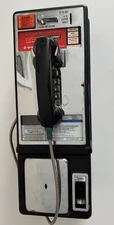 Vintage payphone in very nice condition with mounting plate and pictured key