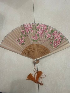 Vintage Japanese folding hand fan with cherry blossom motif