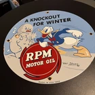 Vintage RPM Motor Oil A Knockout For Winter Porcelain Sign 1940 Walt Disney.