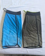 2 PAIR OAKLEY AERO STRETCH 20" SWIM BOARD SHORTS - MENS SZ 36, BLUE AND GREEN