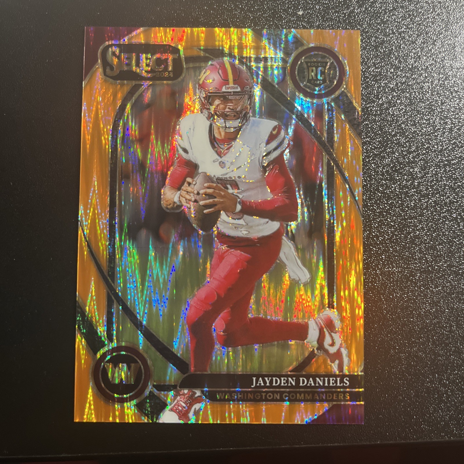 2024 Panini Select - Club Level Jayden Daniels #217 Orange Shock Prizm /399 (RC)
