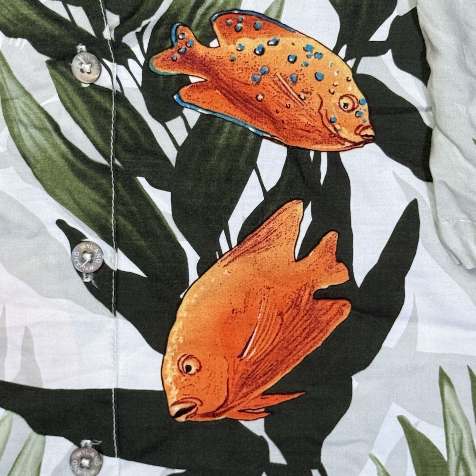 Vintage Wyland AFTCO Bluewater men’s Hawaiian shirt with orange fish rayon and green leaf print on white fabric.