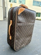 Louis Vuitton Pegase 55 Monogram Rolling Suit...