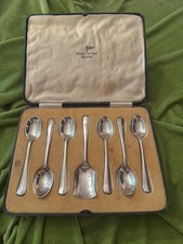 A Cased Set of 6 Silver Walker and Hall Teaspoons and 1 Sugar Shovel #112