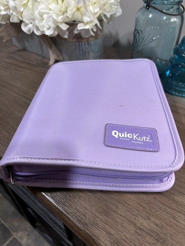 Lavender Quickutz Storage Binder and 53 Animal 2x2 Dies.   Excellent condition