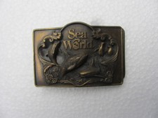 SEA WORLD VINTAGE BRASS BELT BUCKLE LEWIS BUCKLE CO. 1987 VARIUS SERIAL NUMBERS