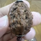 Antique Chinese walnut carvings and a pair of olive pit carvings. — photo 4