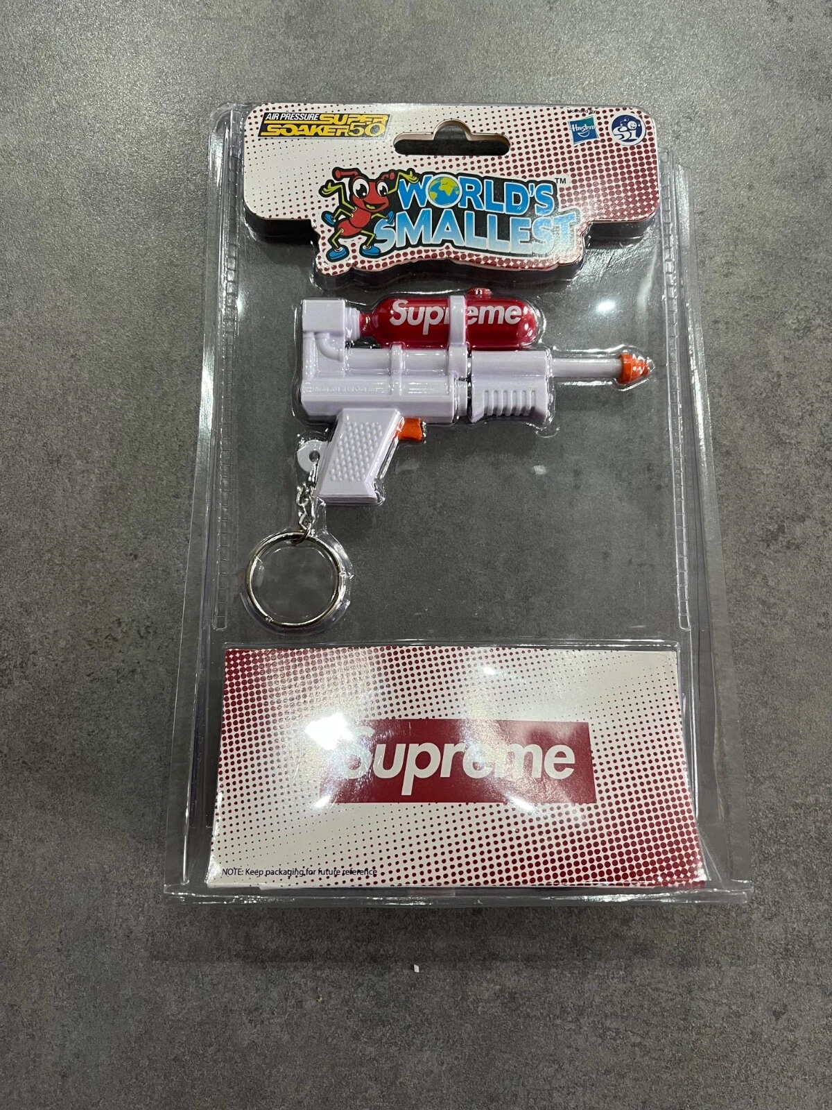 Porte clés Supreme Super Soaker 50 Water Blaster blanc