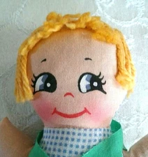 CLOTH DOLL WITH HAND PAINTED FACE 7 INCHES TALL