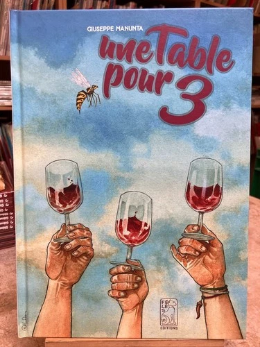 MANUNTA - UNE TABLE POUR 3 - DEDICACE - TBE - EO 2025