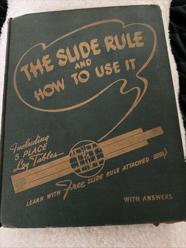 A 1940s book on how to use a slide rule, bundled with an actual slide rule — a complete analog computing starter kit frozen in time.