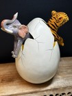 Ceramic Folkart Tiger & Elephant Emerging from Cracked Egg Tonala  7.5T 8” L 6”W — photo 1